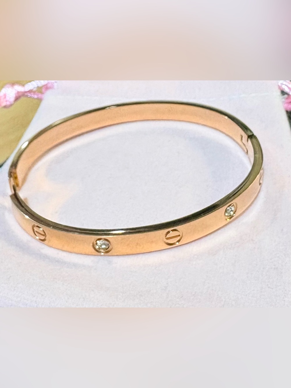 Rose Gold Bangle Bracelet with lock clasp closure.